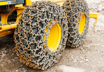 High angle view of chain on earthmover tire