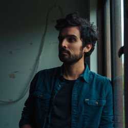 Portrait of young man looking away