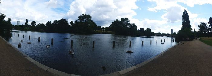 Scenic view of lake against cloudy sky