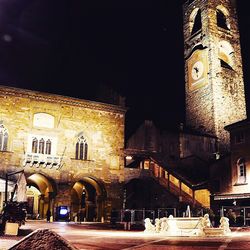 View of buildings in city at night