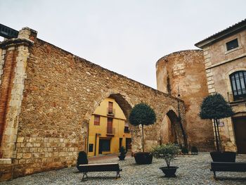 Low angle view of old building against clear sky