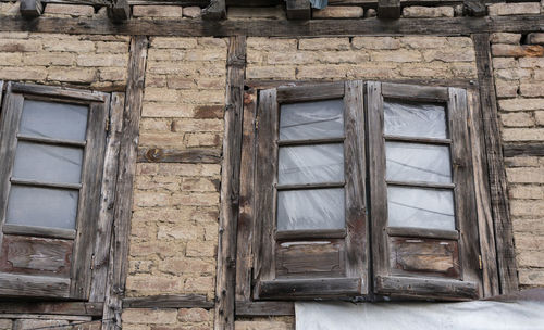 Low angle view of window on old building