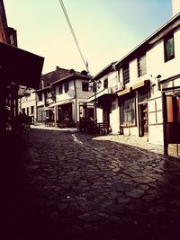 Houses in town against clear sky