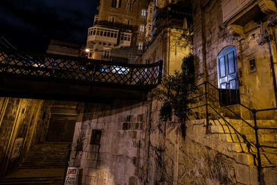 Low angle view of illuminated building at night