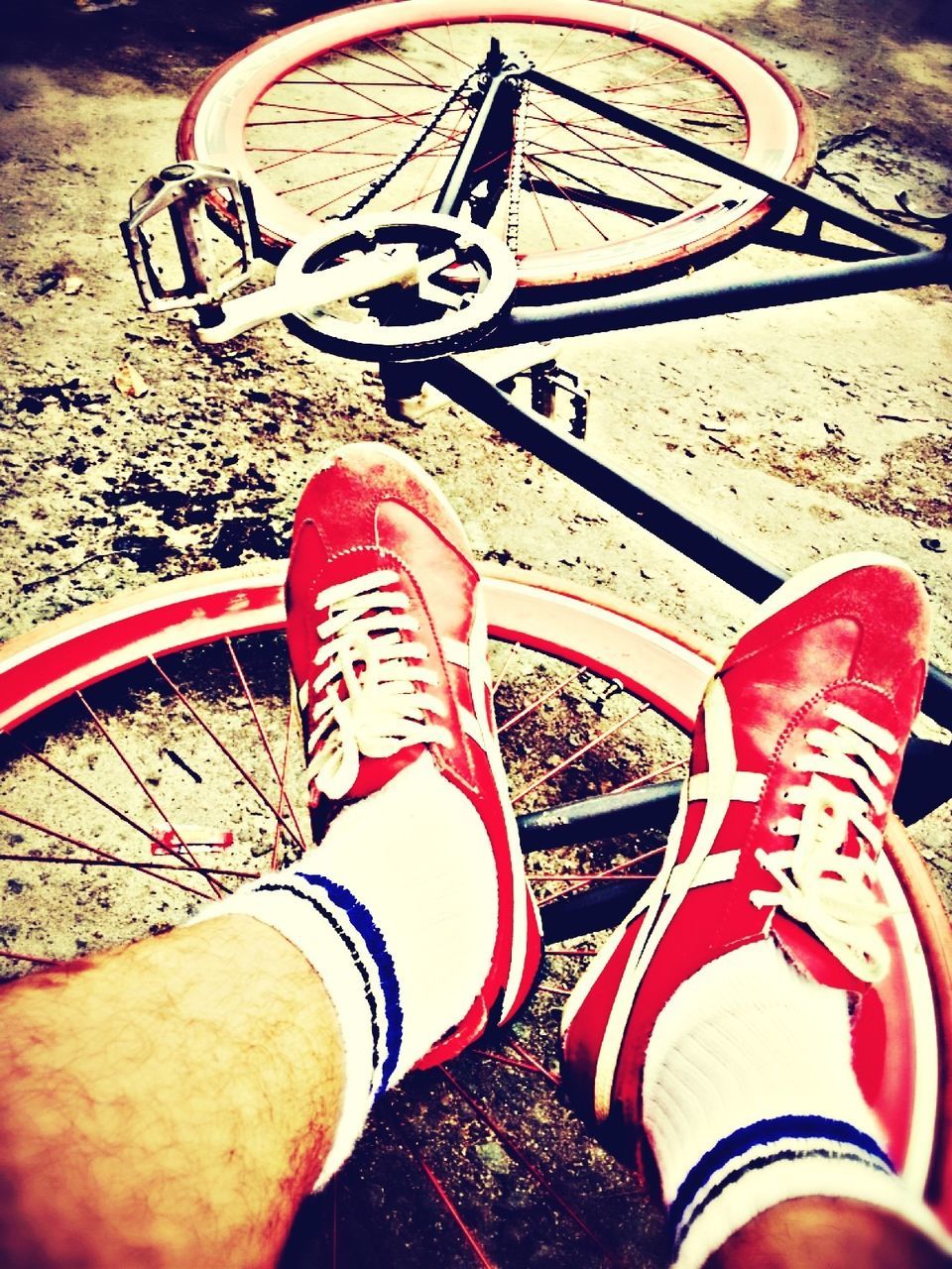 low section, person, transportation, part of, bicycle, mode of transport, leisure activity, lifestyles, personal perspective, shoe, land vehicle, wheel, outdoors, human foot, high angle view, sunlight, cropped