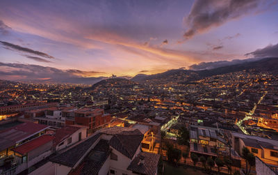 High angle shot of townscape against sky at sunset