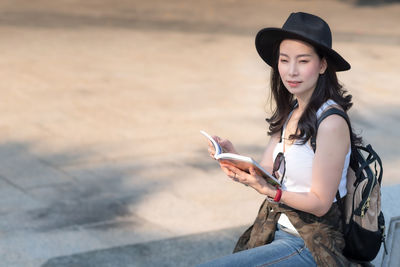 Young woman using mobile phone outdoors