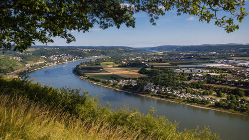 High angle view of river by city against sky