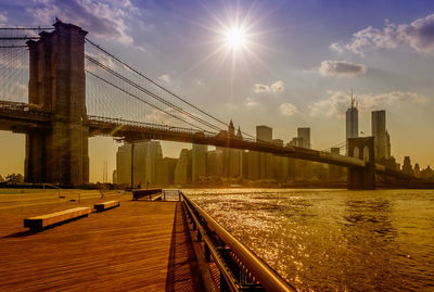 View of suspension bridge against sky during sunset