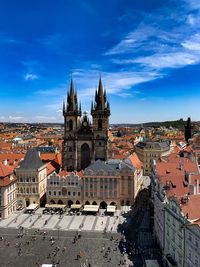 Buildings in city against blue sky