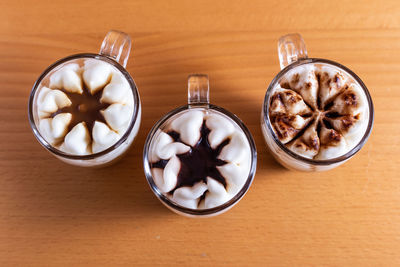 Assortment of mini chocolate desserts in the glass. mini choloate desserts on a rustic background