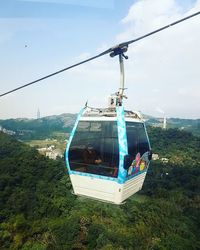 Overhead cable car against sky
