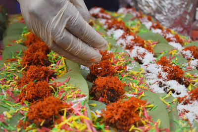 Man preparing paan, a special kind of mouth freshner used in india