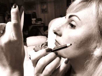 Close-up of woman hand holding cigarette