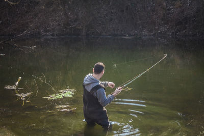 Man fishing in river