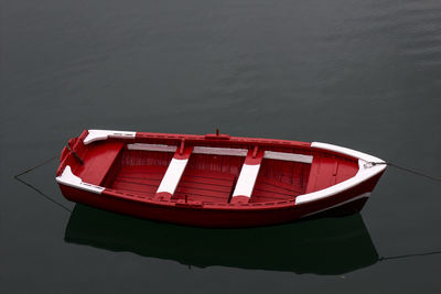 High angle view of red boat moored in lake