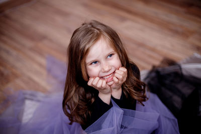 Portrait of a smiling girl looking away