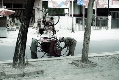 Woman sitting on road