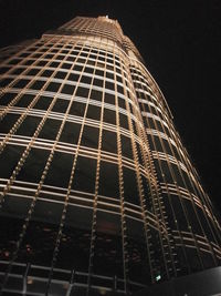 Low angle view of building lit up at night