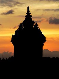 Silhouette temple against sky during sunset