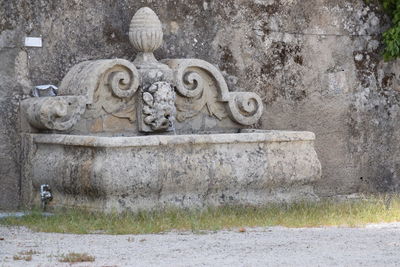 Statue against wall