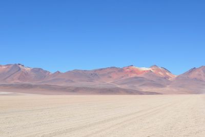 Landscape with mountain range in the background