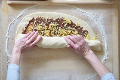 Directly above shot of person preparing food on table