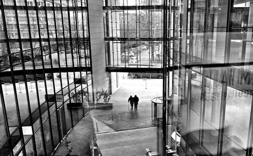 Woman standing in front of modern building