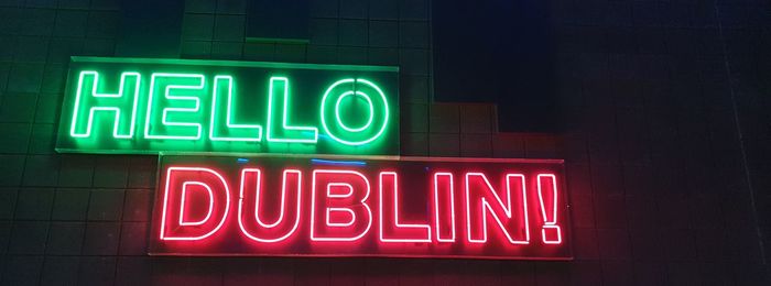 Close-up of illuminated text on wall