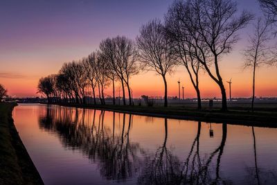 Scenic view of lake at sunset