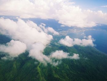 Aerial view of landscape against cloudy sky