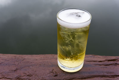 Close-up of beer glass on table