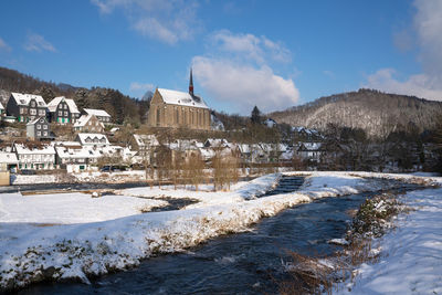 Buildings against sky during winter