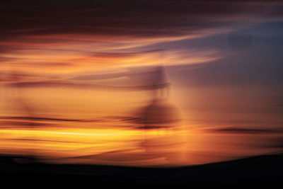 Scenic view of dramatic sky during sunset