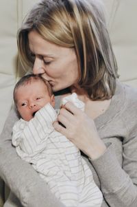 High angle view of mother and daughter at home