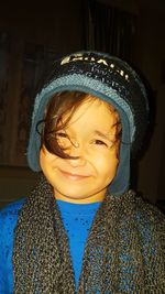 Close-up portrait of smiling boy at home