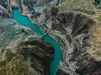 High angle view of river flowing through rocks