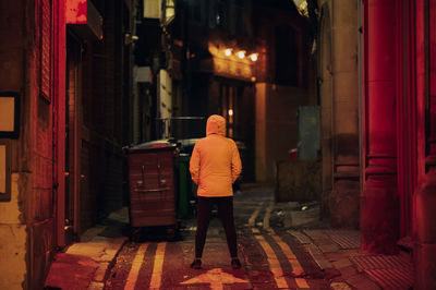 Rear view of man standing in room