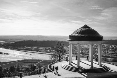 Gazebo in city against sky