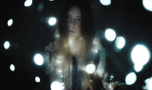 Full frame shot of woman with illuminated lights