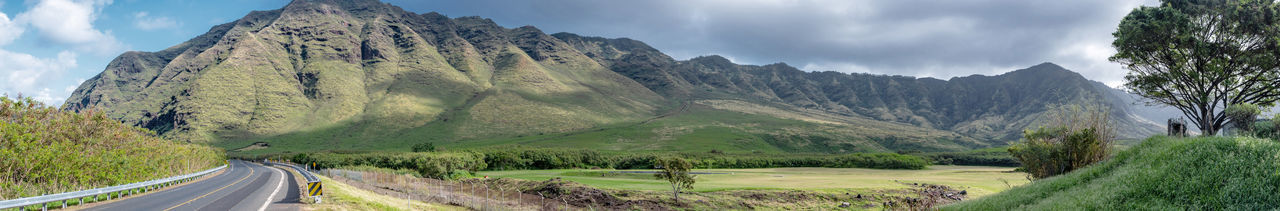 Panoramic view of road amidst mountains against sky