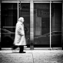 Full length of woman walking in city