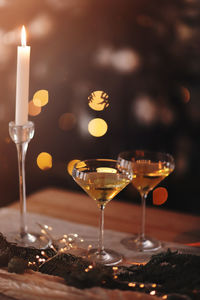 Close-up of wine glasses on table