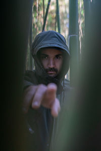 Portrait of a moroccan man pointing towards the camera with his right hand