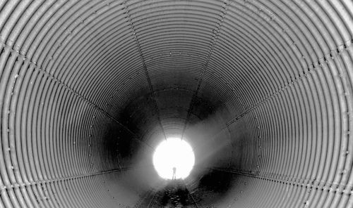 Low angle view of illuminated tunnel