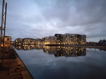 Reflection of buildings in water at night