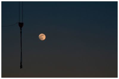 Low angle view of street light against clear sky at night