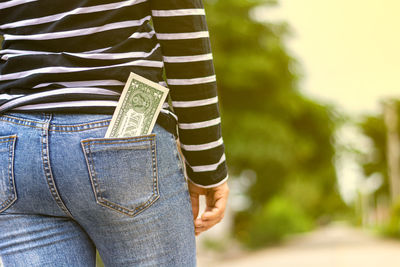 Rear view of woman standing outdoors