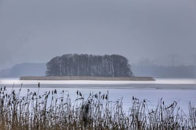 Scenic view of frozen lake against sky