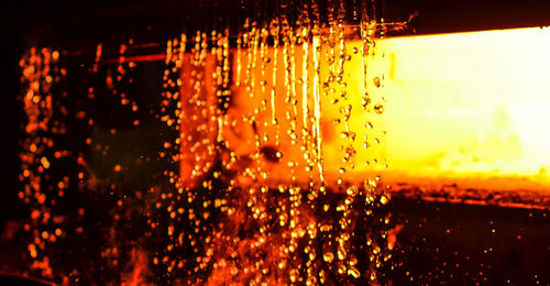 Close-up of wet glass window during rainy season